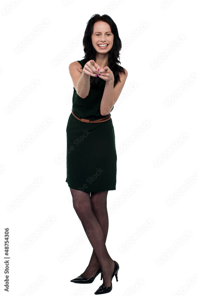 Pretty brunette in trendy wear pointing you out Pretty brunette in trendy wear pointing you out