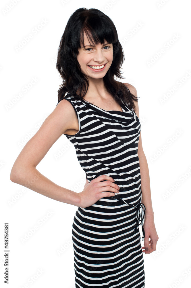 Fashionable young girl in trendy sleeveless attire Fashionable young girl in trendy sleeveless attire