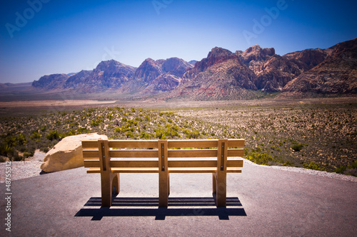 Fotografie Bench and scenic view of mountain landscape
