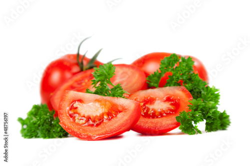 Cut tomatoes into slices with parsley leaves