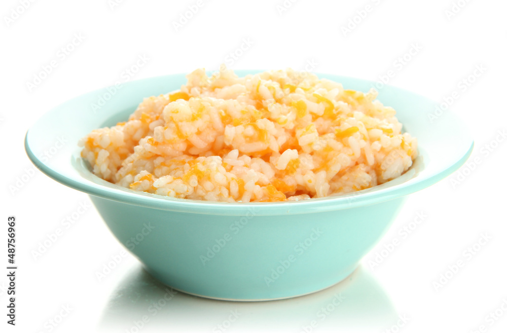 Taste rice porridge with pumpkin in blue bowl, isolated Taste rice porridge with pumpkin in blue bowl, isolated