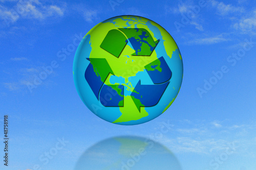 recycle symbol on earth with blue sky background