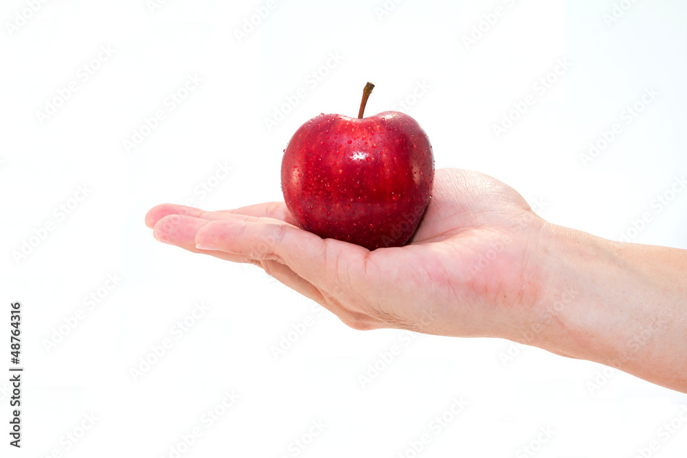 hand with an apple isolated on white background hand with an apple isolated on white background