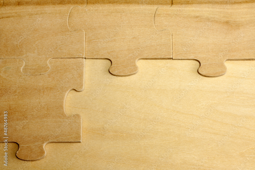 Puzzle on wooden boards abstract background concept Puzzle on wooden boards abstract background concept