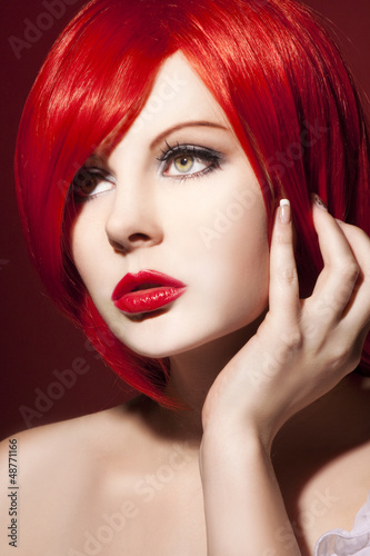 beautiful woman portrait with glossy red hair