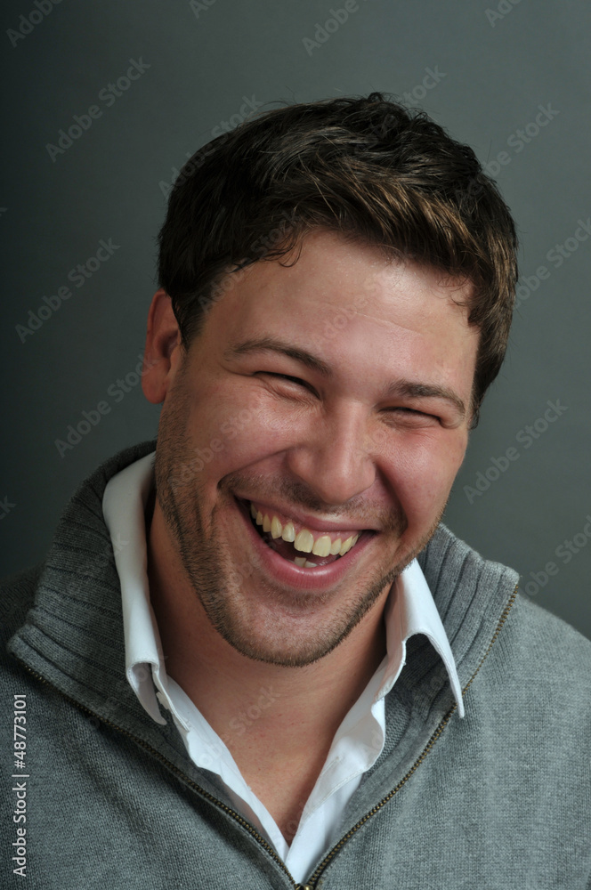 Obraz premium Young male actor making emotional facial expression