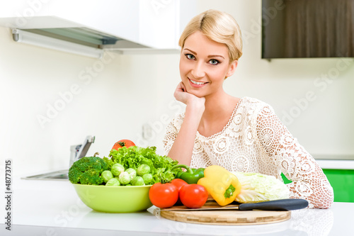Young woman in the kitchen.Healthy Food. Dieting Concept.