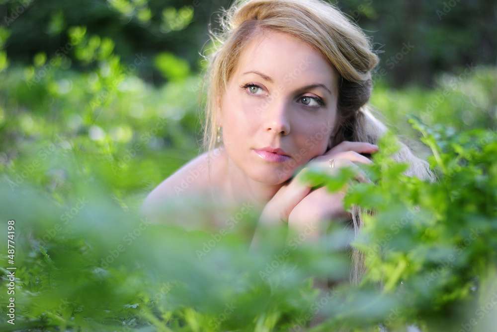 beautiful girl in wood amongst green sheet beautiful girl in wood amongst green sheet