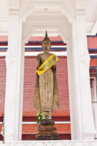 standing buddha statue in thailand