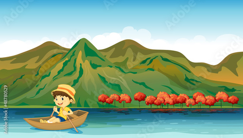 A river and a smiling boy in a boat