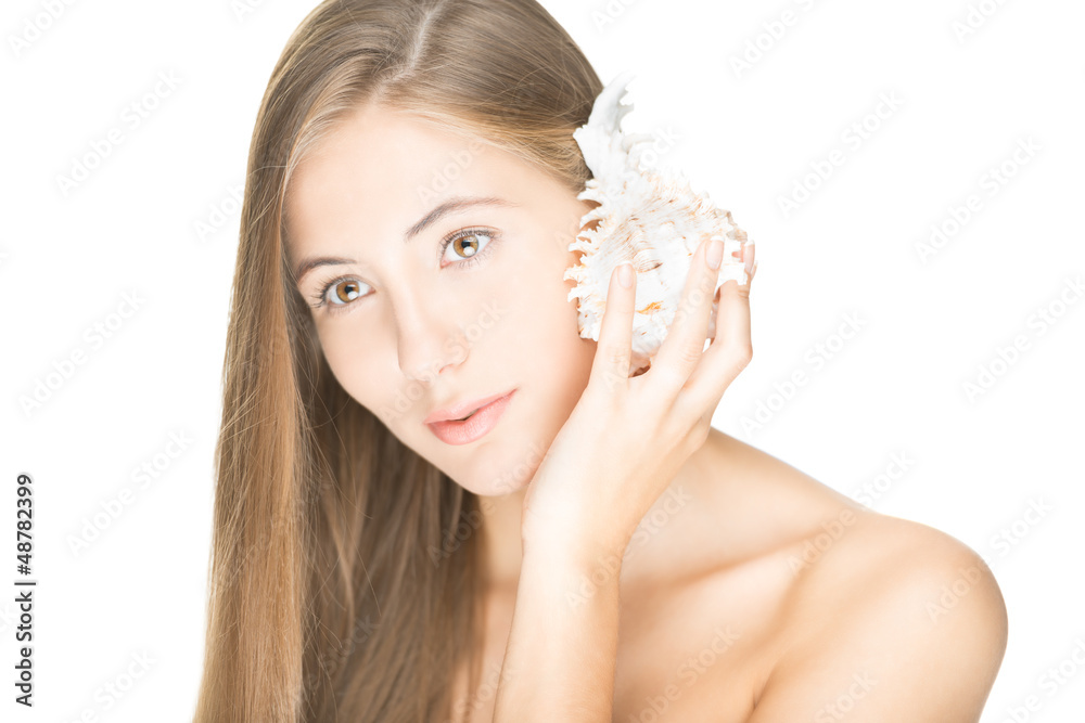 Fototapeta premium Pretty woman with seashell isolated on white.