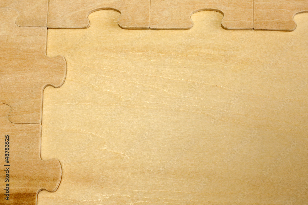 Puzzle on wooden boards abstract background concept Puzzle on wooden boards abstract background concept
