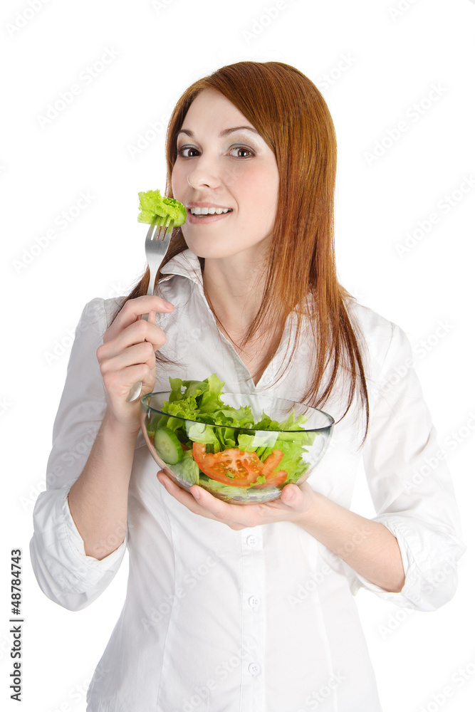 pretty young lady eating salad. isolated on white pretty young lady eating salad. isolated on white