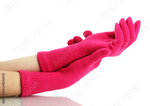 woman knitted gloves on hands, isolated on white photo