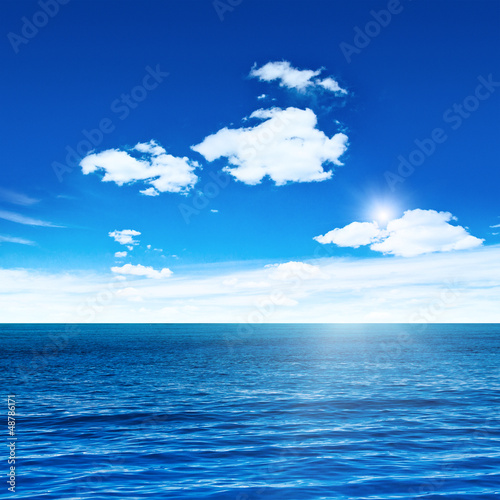 Blue sea and sky with sun
