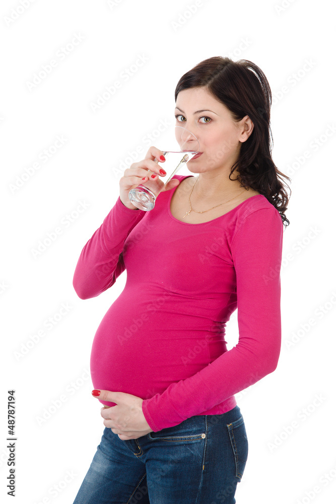 pregnant woman drinking water. isolated on white pregnant woman drinking water. isolated on white