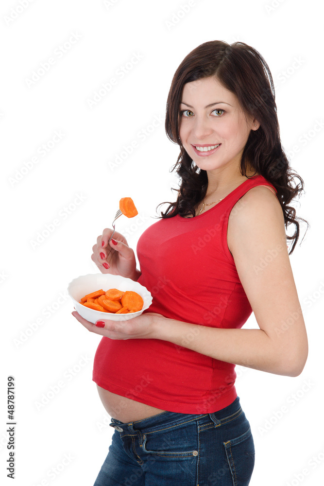 pregnant woman eating salad. isolated on white pregnant woman eating salad. isolated on white