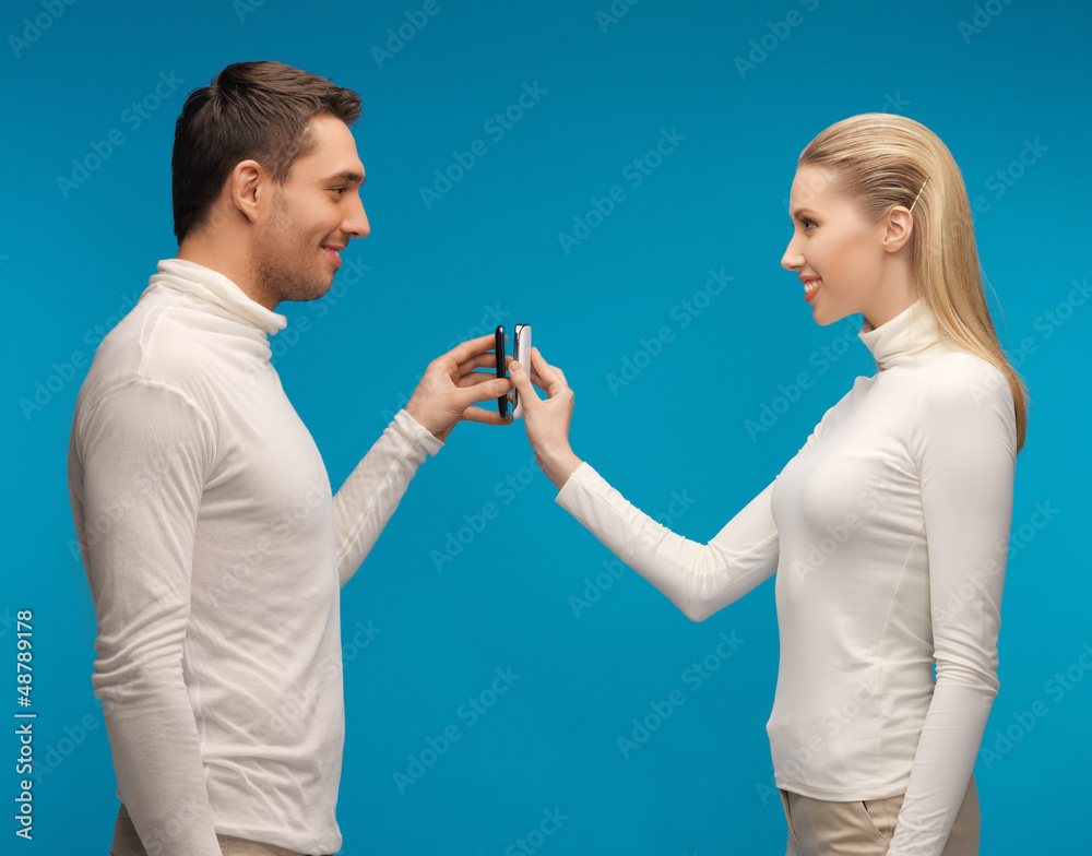 man and woman with modern gadgets man and woman with modern gadgets