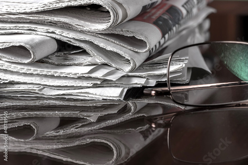 pile of newspaper & glasses © librakv