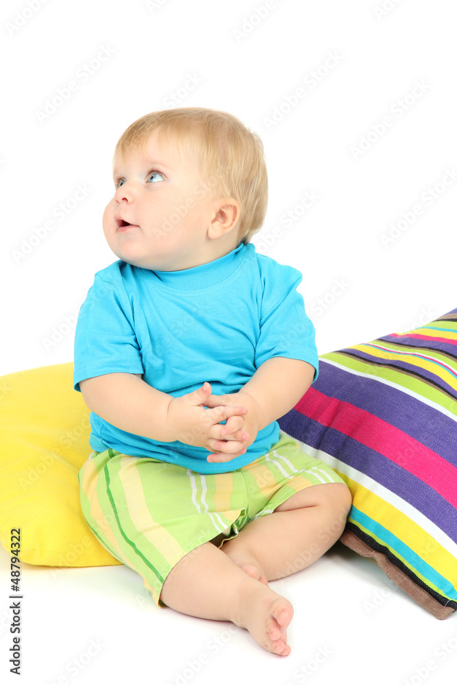 Little boy and color pillows, isolated on white Little boy and color pillows, isolated on white