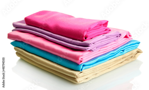 heap of cloth fabrics isolated on white