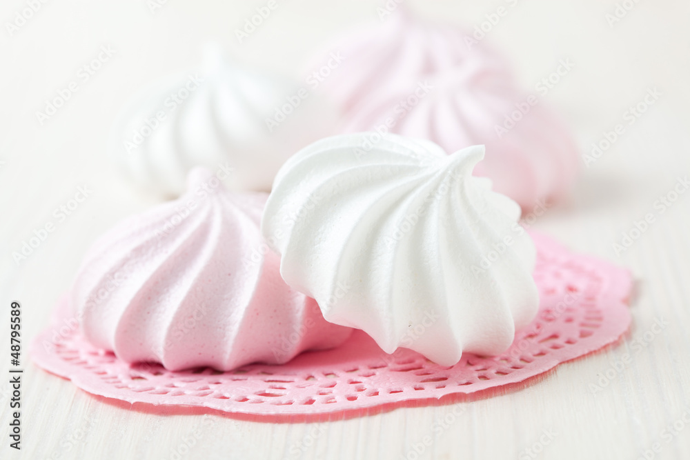 Meringues on pink mat