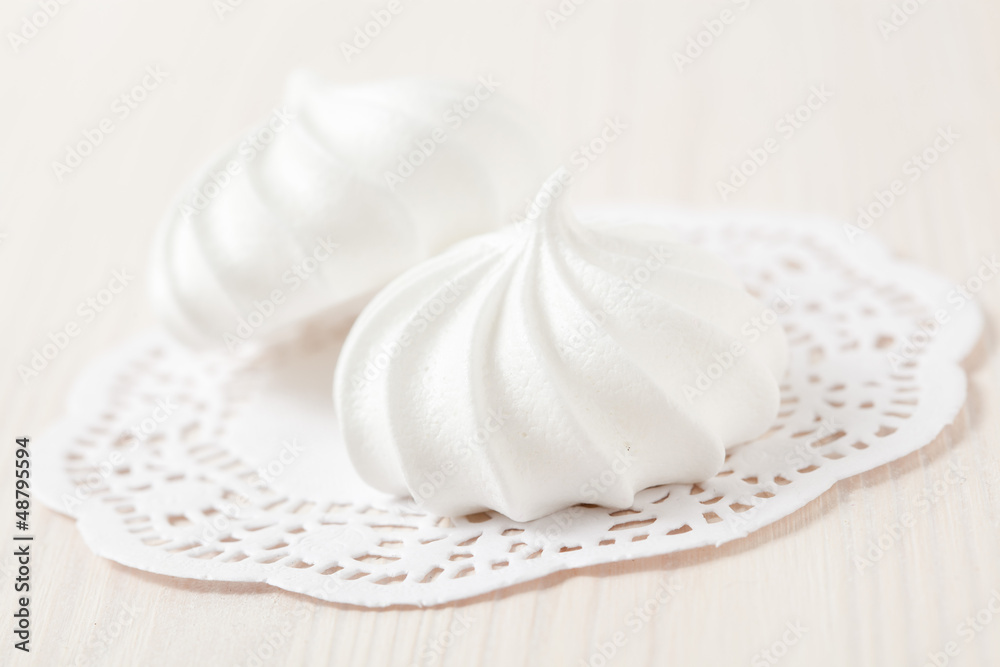Meringues on white mat Meringues on white mat