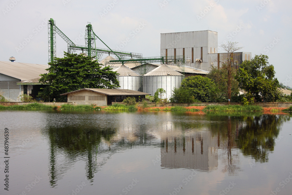 industrial, silo near pond. industrial, silo near pond.