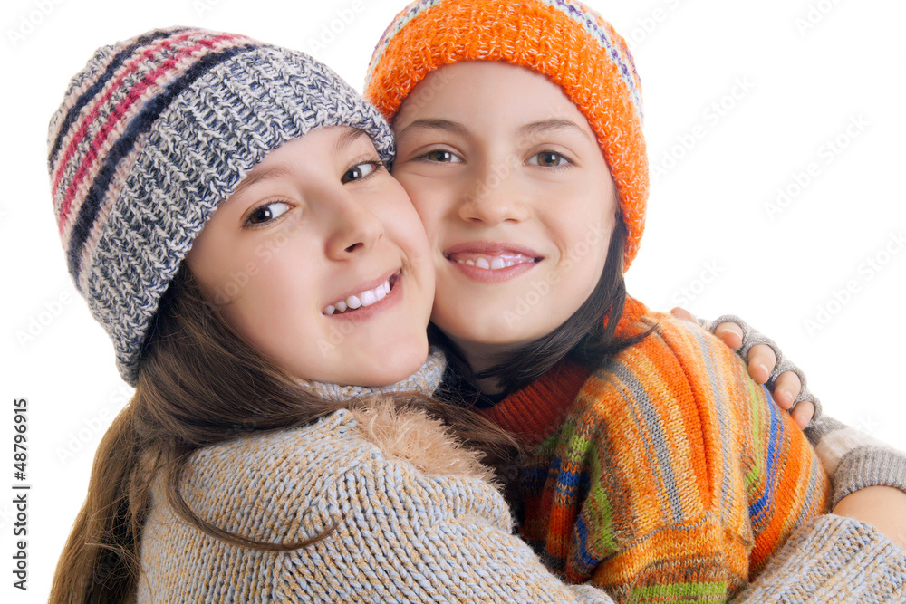 Beautiful young girls in warm winter clothes hugging Beautiful young girls in warm winter clothes hugging