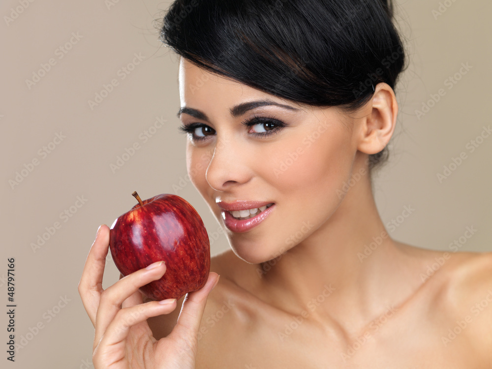 Beautiful brunette with a red apple Beautiful brunette with a red apple