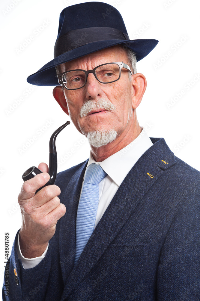 Well dressed senior man with glasses smoking pipe. Isolated. Well dressed senior man with glasses smoking pipe. Isolated.