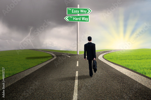 Businessman choosing easy way road