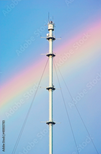 Radio mast against a rainbow © andrew