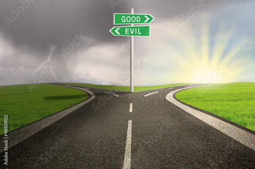 Road sign of good vs evil photo