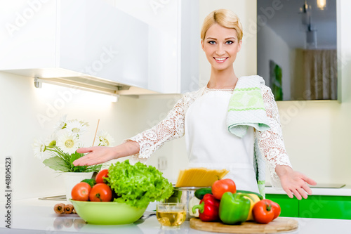 Young woman in the kitchen.Healthy Food. Dieting Concept.