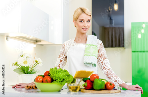 Young woman in the kitchen.Healthy Food. Dieting Concept.
