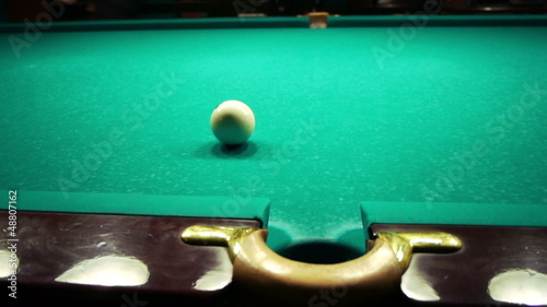 Playing russian billiard in a poolroom photo