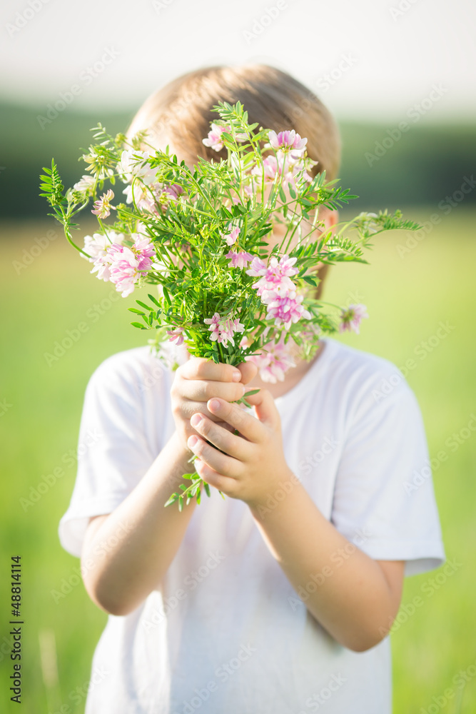 Boy hiding by bouquet