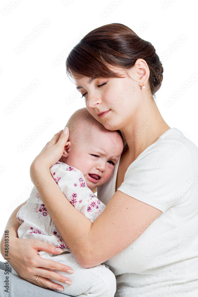 Mother trying to comfort her crying baby isolated Mother trying to comfort her crying baby isolated