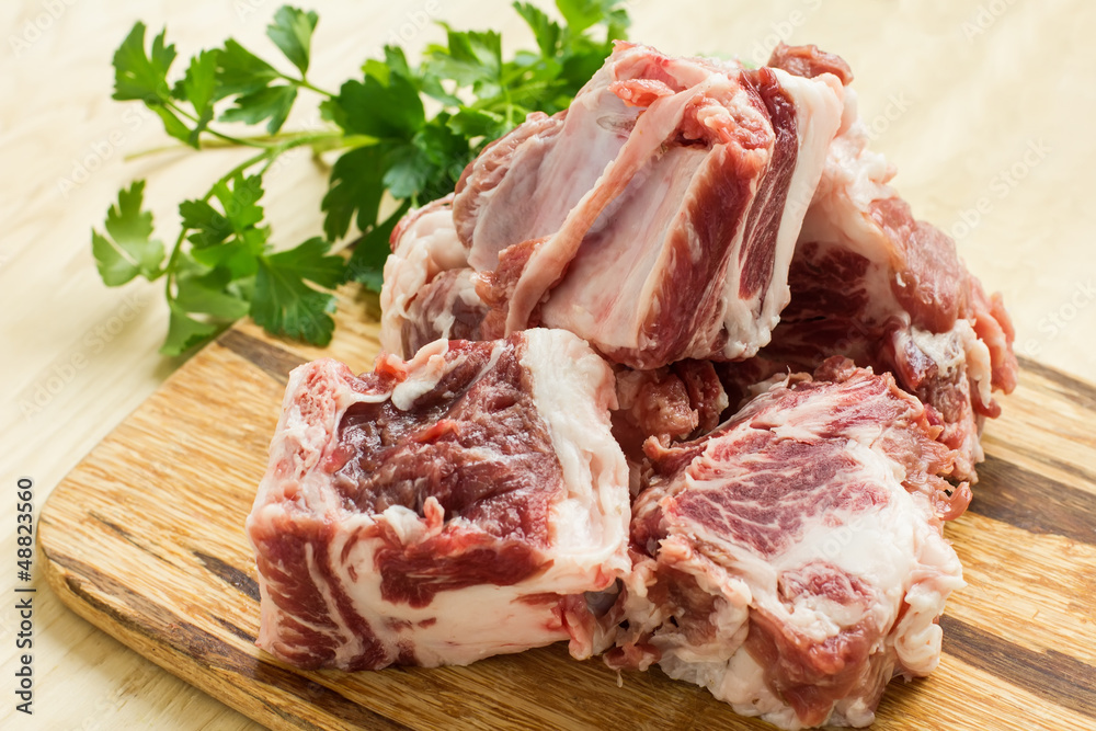 Fresh raw meat on wooden background