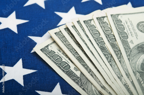 american dollars bills on flag