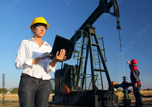 Workers in an Oilfield, teamwork © branex