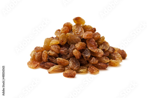 Pile of raisins isolated on white background