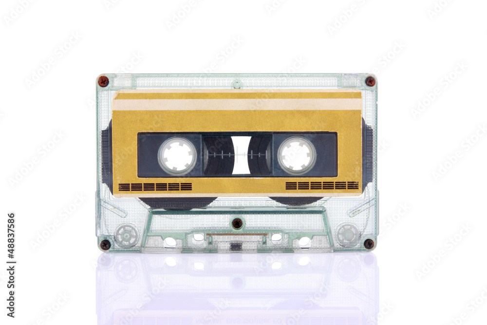 Compact Cassette isolated on white with blank gold color label