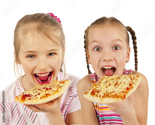 Young girls preparing homemade pizza