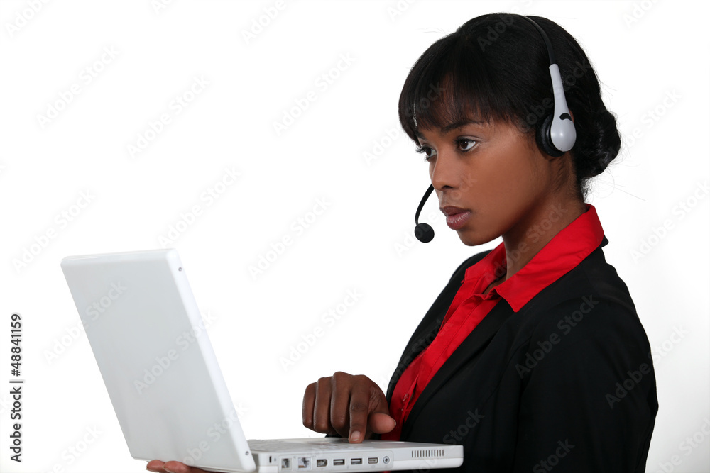 An African American businesswoman at work. An African American businesswoman at work.