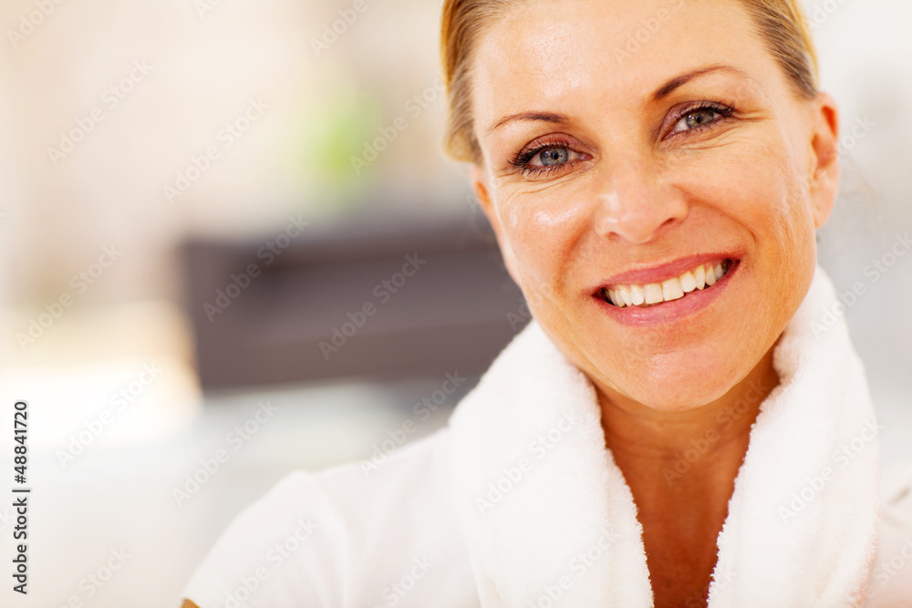 fit middle aged woman closeup portrait with towel on her neck fit middle aged woman closeup portrait with towel on her neck