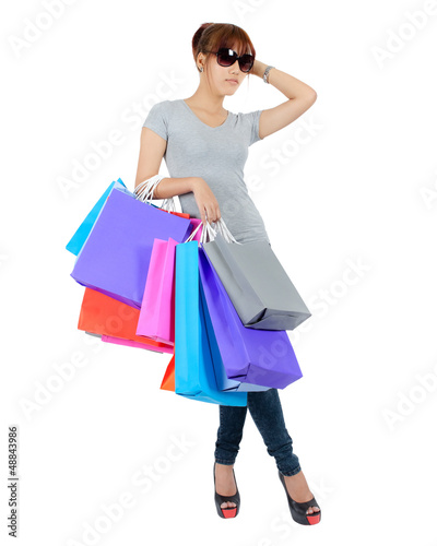 Isolated Yong Asian Woman With colorful Shopping Bags