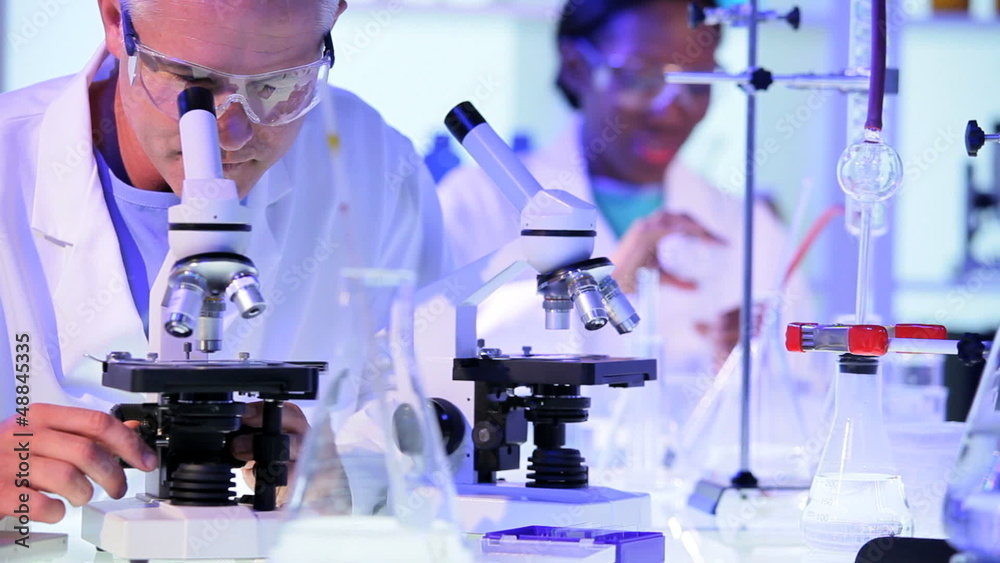 Three Doctors Working in Hospital Laboratory Three Doctors Working in Hospital Laboratory