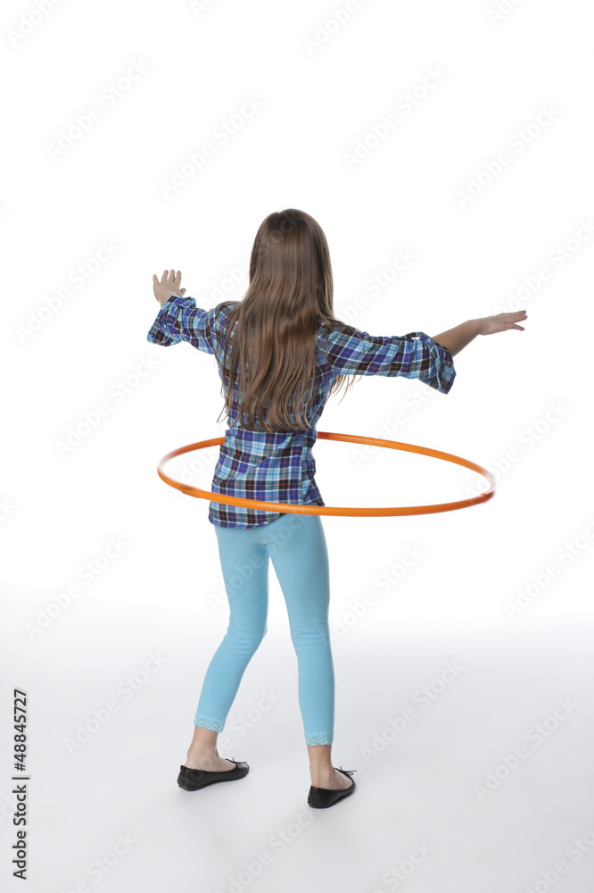 Caucasian girl twirling plastic hoop Caucasian girl twirling plastic hoop